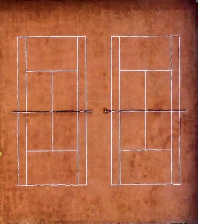 Aerial view of the academy's floodlit courts